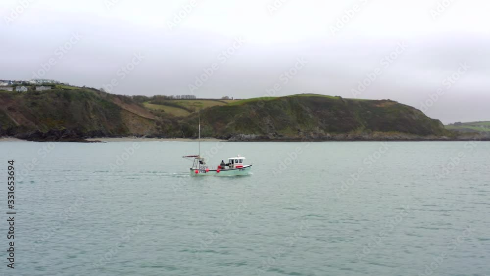 Fishing Boat Heading Out to Sea in Cornwall UK Fishing Boat Heading Out to Sea in Cornwall UK