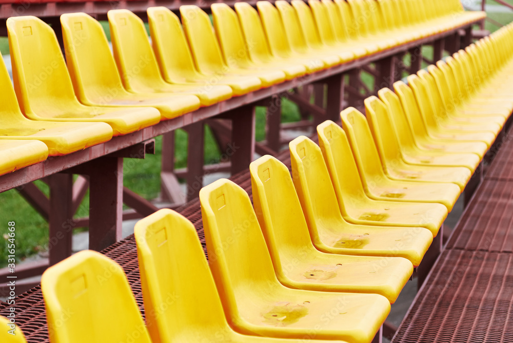Obraz premium empty seats in the stands of a sports stadium.