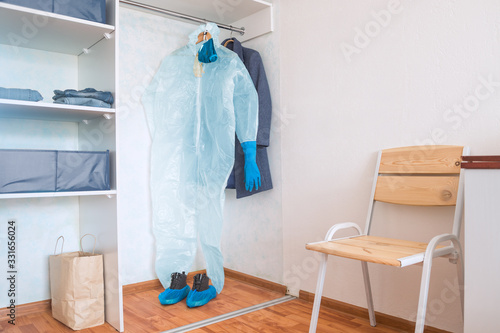 hazmat suit hanging in home wardrobe © aygulchik99