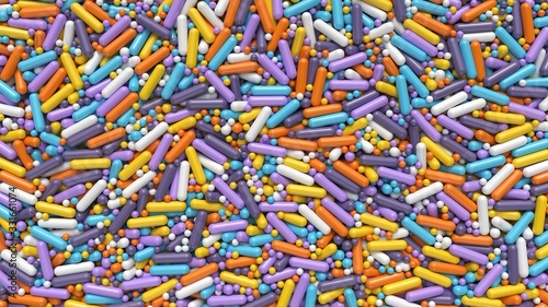 Huge pile of colorful balls and capsules abstract background