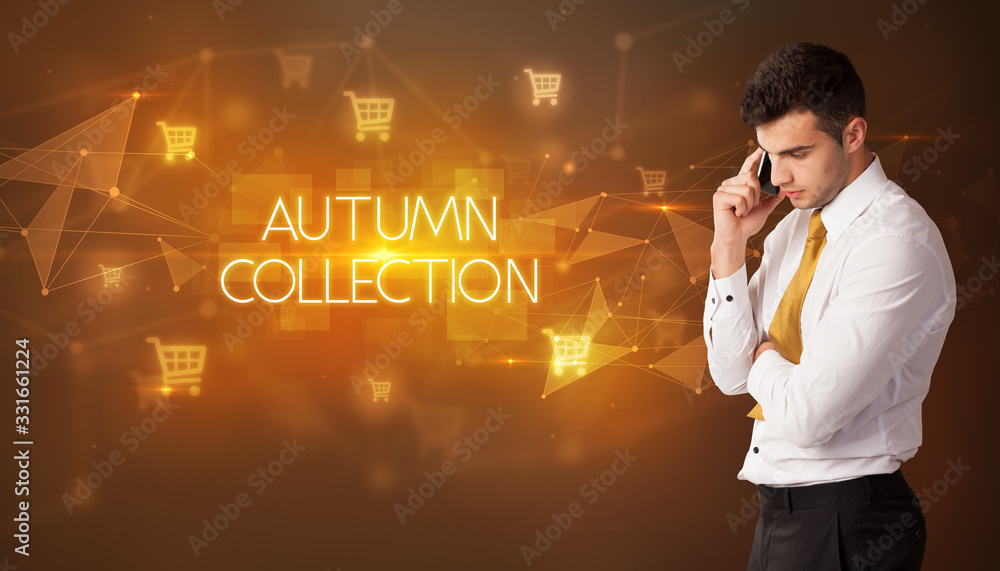 Businessman with shopping cart icons and AUTUMN COLLECTION inscription, online shopping concept Businessman with shopping cart icons and AUTUMN COLLECTION inscription, online shopping concept