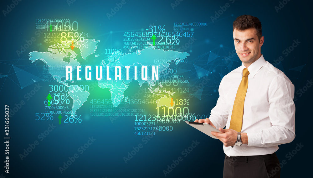 Businessman in front of a decision with REGULATION inscription, business concept Businessman in front of a decision with REGULATION inscription, business concept