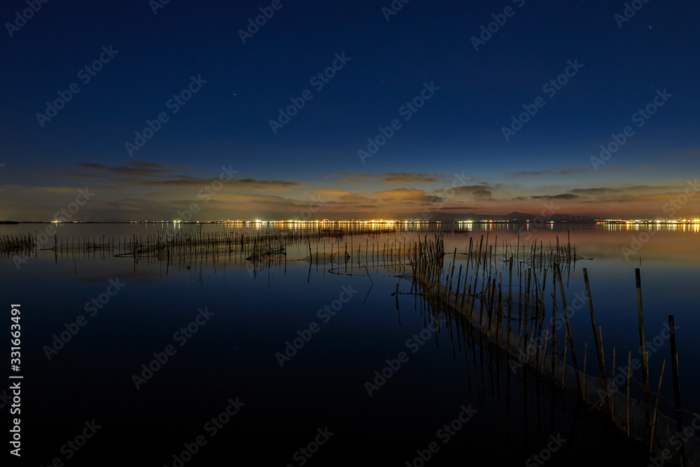 Last lights of the day in the lagoon of Valencia, Spain