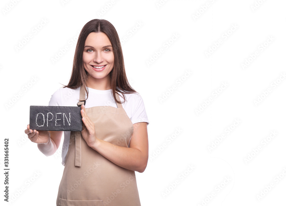 Young woman in apron with tablet isolated on white background Young woman in apron with tablet isolated on white background