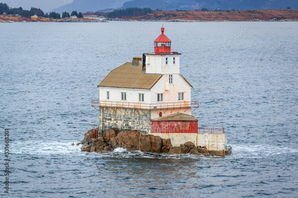 STABBEN LIGHTHOUSE, NORWAY - 2016 NOVEMBER 30. Lighthouse of Stabben on a rock in the norwegian coast. STABBEN LIGHTHOUSE, NORWAY - 2016 NOVEMBER 30. Lighthouse of Stabben on a rock in the norwegian coast.