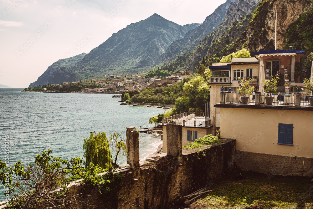 Old town in italy at a lake in Spring with cozy clouds and mood at Riva del Garda, Lago di Garda