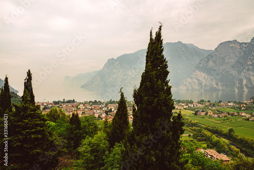 Old town in italy at a lake in Spring with cozy clouds and mood at Riva del Garda, Lago di Garda