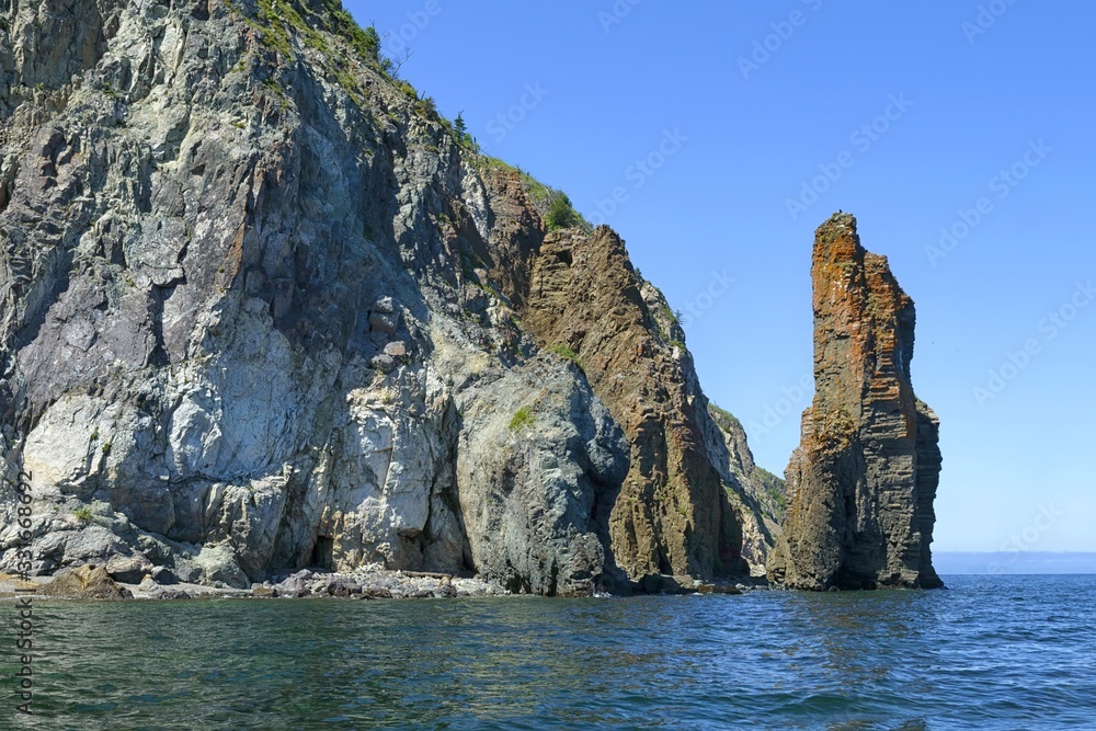 Rocks and sea stacks on the Tatar strait coast. Ivanov cape, Sikhote-Alin mountain ridge. Khabarovsk region, far East, Russia.