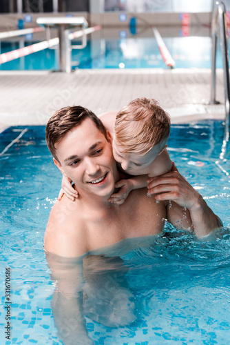 cute toddler boy hugging happy swim coach in swimming pool © LIGHTFIELD STUDIOS