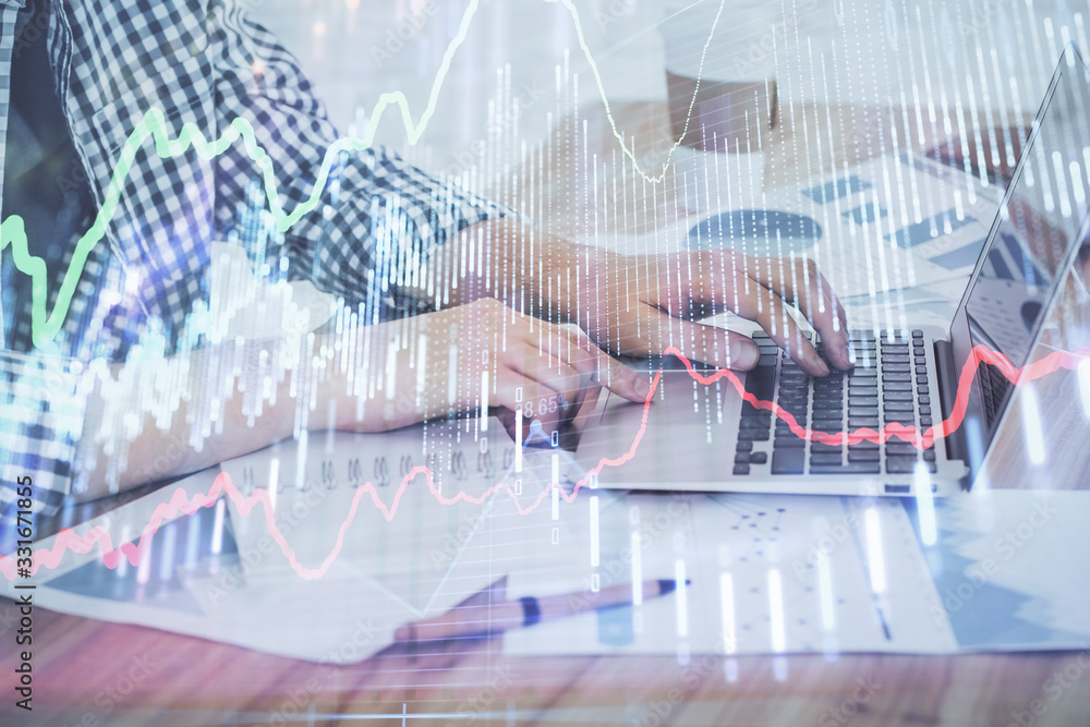 Fototapeta premium Multi exposure of stock market chart with man working on computer on background. Concept of financial analysis.