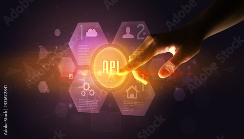 Hand touching API inscription, new technology concept © ra2 studio