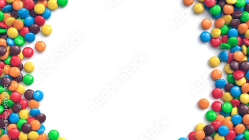 Double border of colorful coated chocolate candies on white background