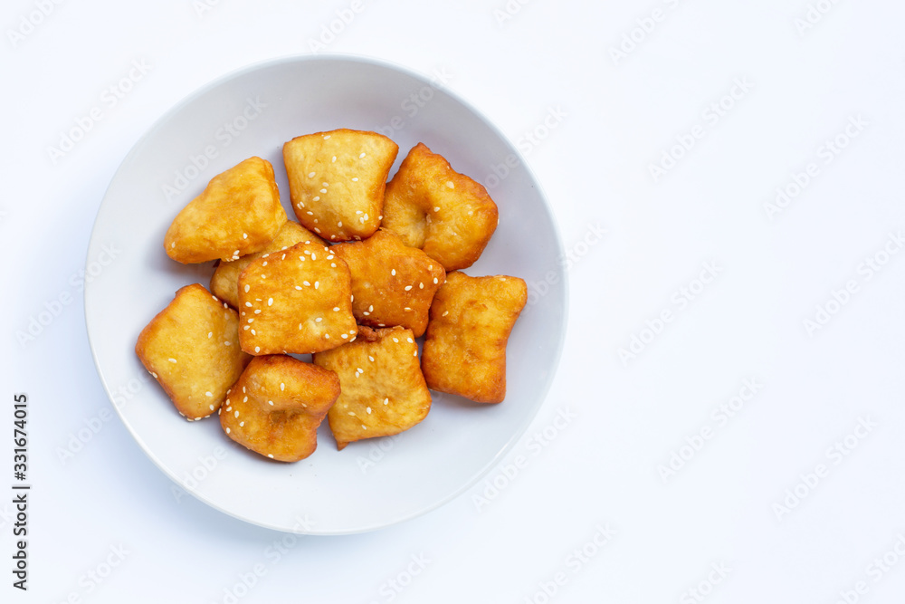 Chinese deep fried dough sticks with white sesame seeds. Chinese deep fried dough sticks with white sesame seeds.