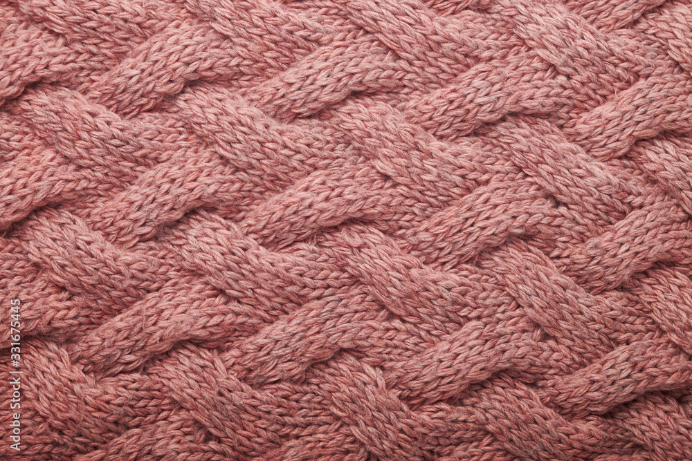 knitted carpet close -up. Textile texture on a white background. Detailed warm yarn background. Knit cashmere beige wool. Natural wool fabric, a fragment of a sweater. knitted carpet close -up. Textile texture on a white background. Detailed warm yarn background. Knit cashmere beige wool. Natural wool fabric, a fragment of a sweater.