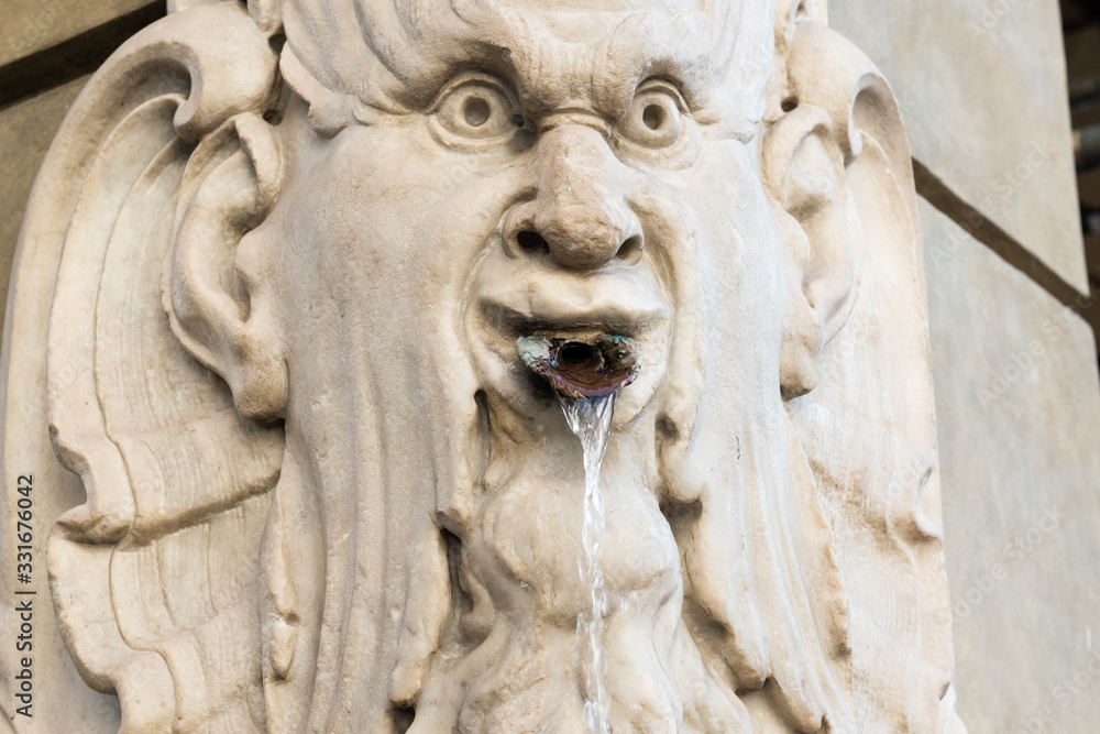 fountain in white marble in the shape of a head, piazza della signoria, Florence