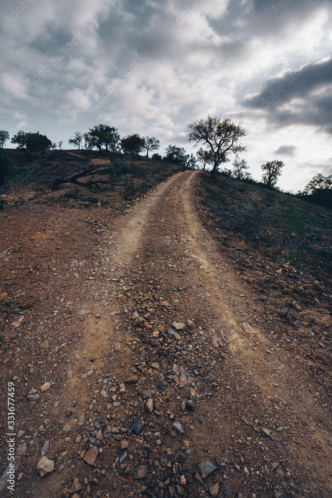 Mountain road between valleys and in Portugal at sunset