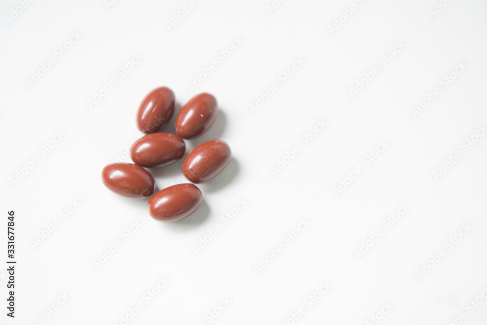 red pills on white background