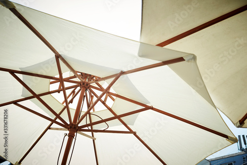 White parasols at cafe terrace 