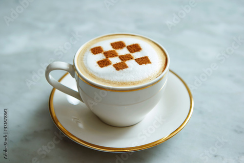 Latte art with checkered pattern 