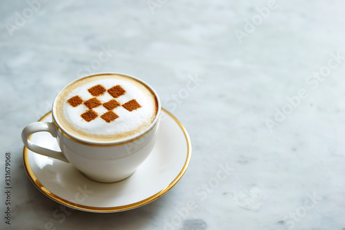 Latte art with checkered pattern 
