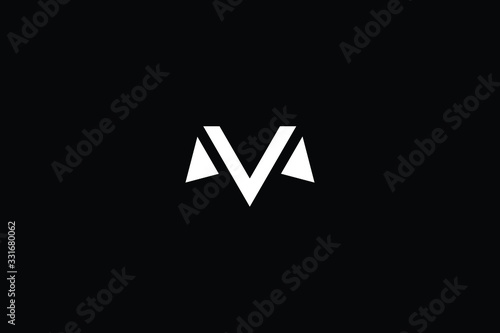 Minimal elegant monogram art logo. Outstanding professional trendy awesome artistic M MV VM initial based Alphabet icon logo. Premium Business logo in White color on black background