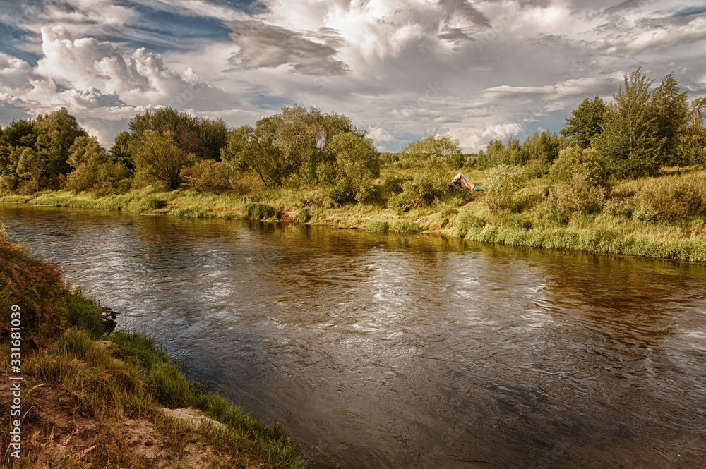 cloudy clouds over the river in summer