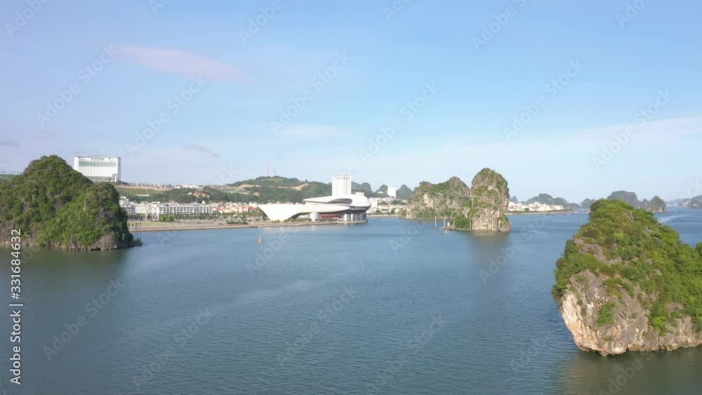 Aerial view of royalty high quality free stock footage over natural rocks green tops Halong bay, Halong city, sea blue azure water. Wild natural untouched seascape. Asia, Vietnam Aerial view of royalty high quality free stock footage over natural rocks green tops Halong bay, Halong city, sea blue azure water. Wild natural untouched seascape. Asia, Vietnam