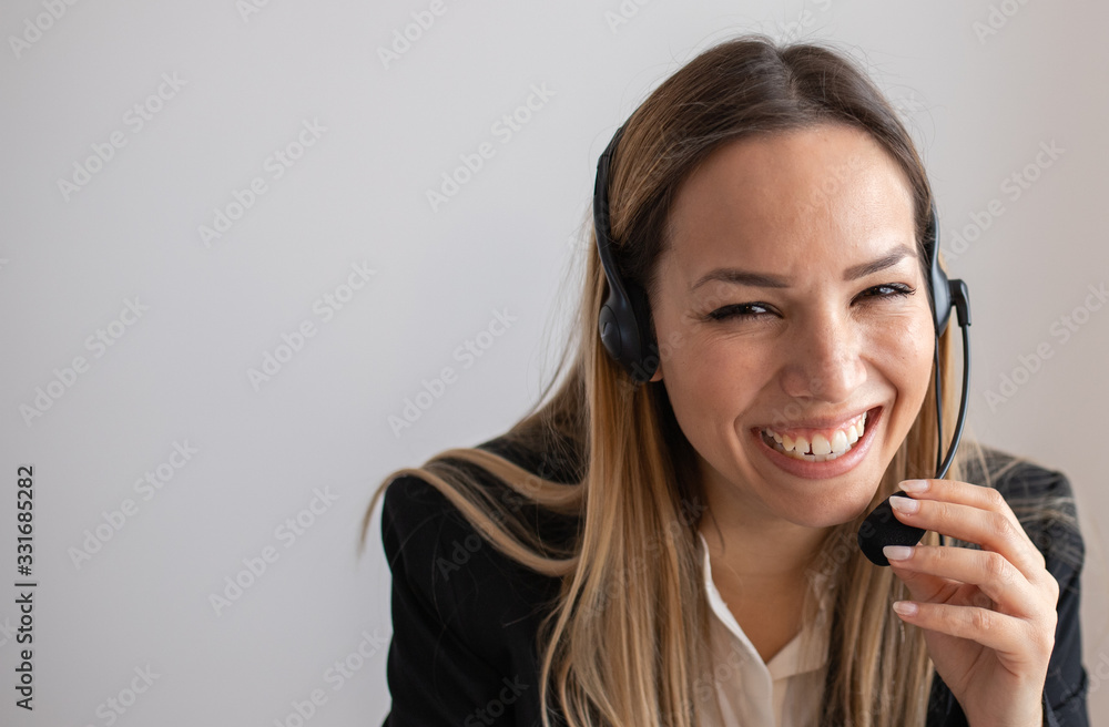Young woman working in call center. Customer support woman in office Young woman working in call center. Customer support woman in office