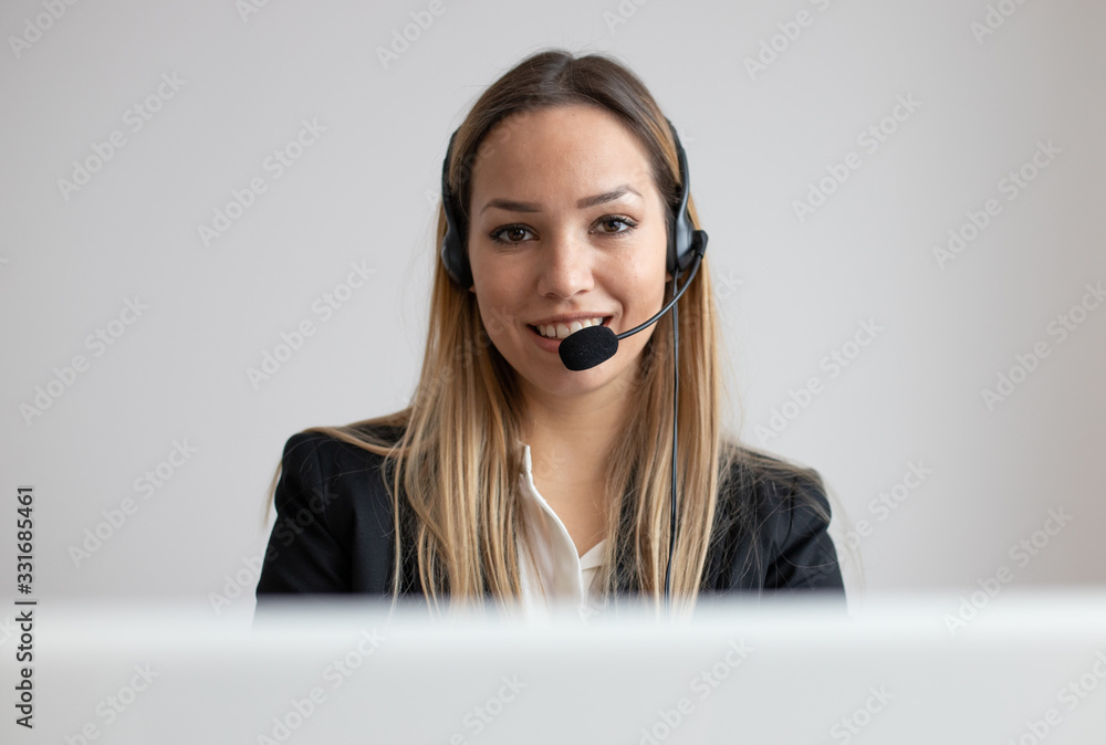 Young woman working in call center. Customer support woman in office Young woman working in call center. Customer support woman in office