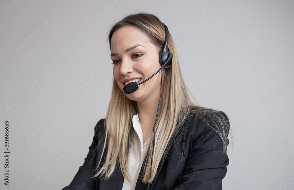Young woman working in call center. Customer support woman in office Young woman working in call center. Customer support woman in office