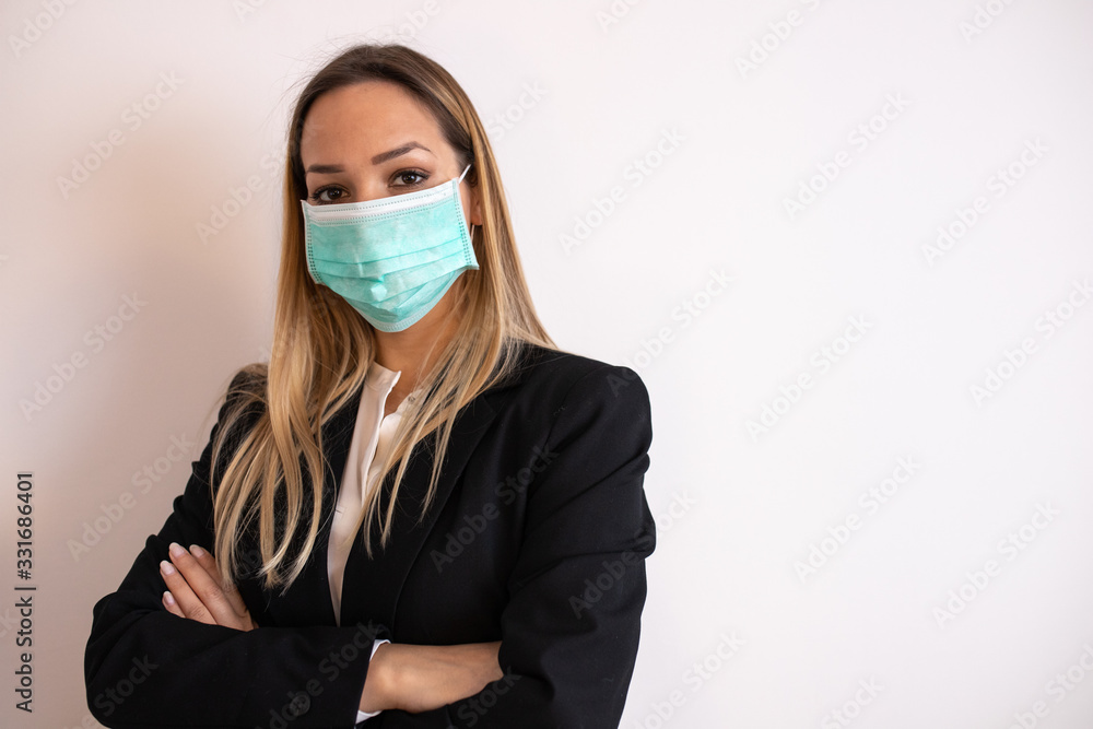 The young business woman in medical mask The young business woman in medical mask