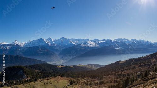 panorama of Eiger, Moench and Jungfrau mountains with blue sky