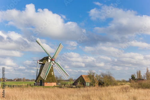 Historic windmill and house in the Kardinge recreation area in Groningen, Netherlands