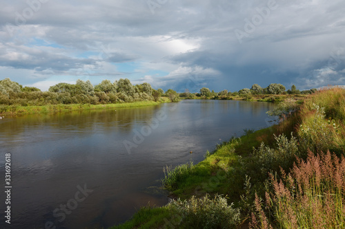 cloudy clouds over the river in summer