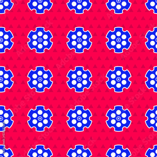 Blue Revolver cylinder icon isolated seamless pattern on red background. Vector Illustration