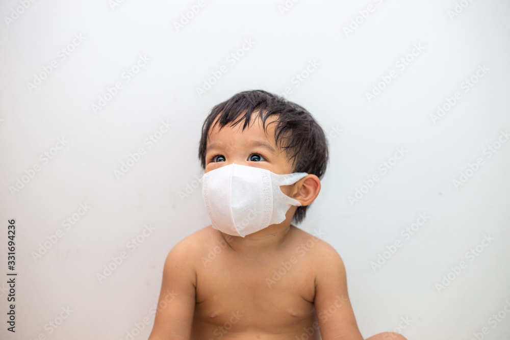 Portrait of asian baby boy wearing dust mask protect for PM2.5 and coronavirus or covid-19 infectious disease on white background. Portrait of asian baby boy wearing dust mask protect for PM2.5 and coronavirus or covid-19 infectious disease on white background.
