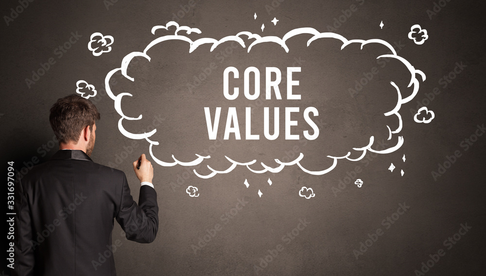 businessman drawing a cloud with CORE VALUES inscription inside, modern business concept businessman drawing a cloud with CORE VALUES inscription inside, modern business concept