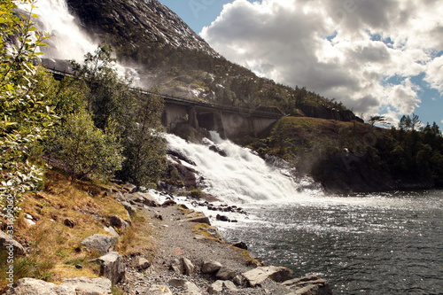 Waterfall Langfossand power station. National tourist route. Famous landmark in Norway at summer time.Beautiful 612m high Langfoss waterfall in Southern Norway.