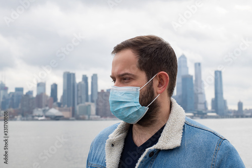 Man wearing medical protective mask. Coronavirus epidemic and air pollution in the city