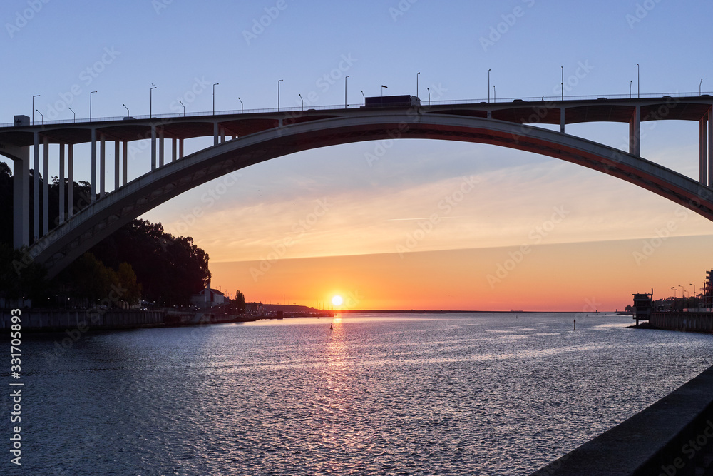 Naklejka premium Arched bridge high above the strait