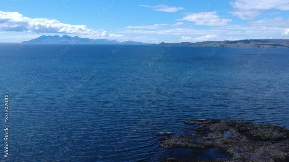 Tilt-down revealing drone shot of blue ocean Tilt-down revealing drone shot of blue ocean
