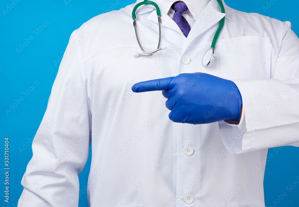 medic man in white coat with buttons, on hands wearing blue sterile gloves medic man in white coat with buttons, on hands wearing blue sterile gloves