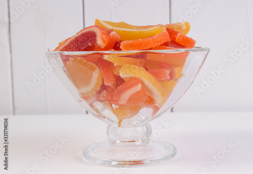 citrus marmalade in a candy bowl on a white background