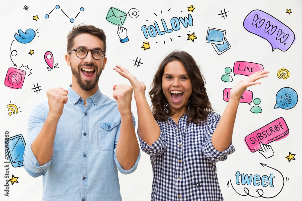 © Mangostar - Couple rejoicing with hand drawn social media sketches. Happy excited pair making winner gestures, celebrating success. Young woman in casual and man in glasses. Good news concept © Mangostar - Couple rejoicing with hand drawn social media sketches. Happy excited pair making winner gestures, celebrating success. Young woman in casual and man in glasses. Good news concept