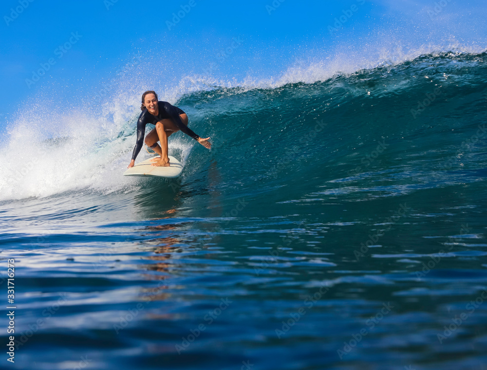 Female surfer on a wave