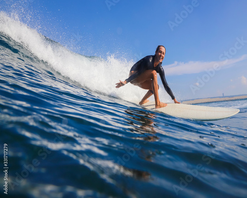 Female surfer on a wave