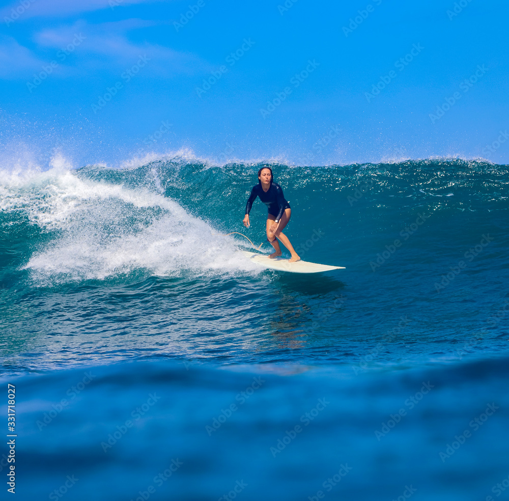 Female surfer on a wave