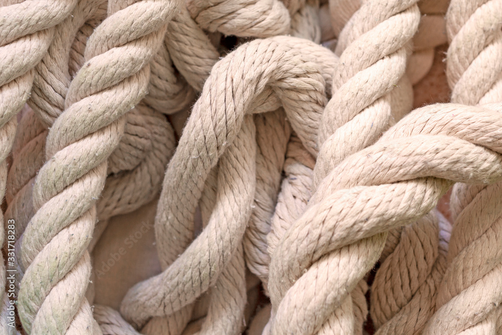 white rope lying on the floor, top view. white rope lying on the floor, top view.