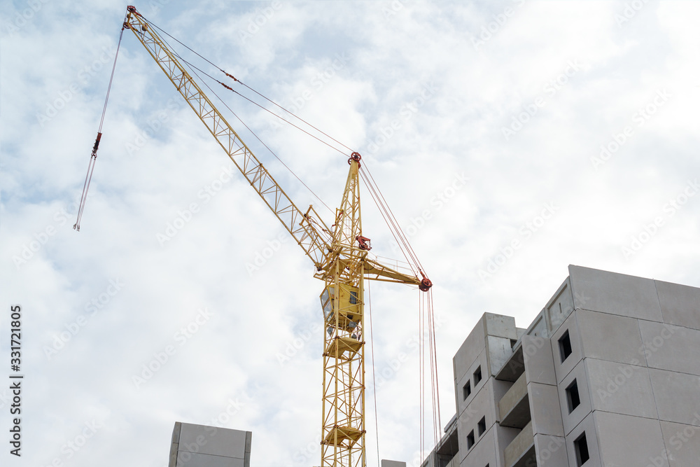 tower crane on sky background and buildings under construction tower crane on sky background and buildings under construction