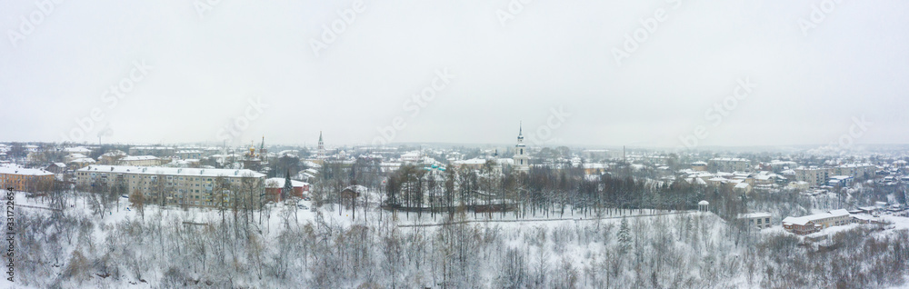 Panorama of the small town of Slobodskoy near Kirov on a winter day from above. Russia from the drone